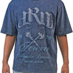 Man wearing a blue acid wash graphic t-shirt with text and design elements.