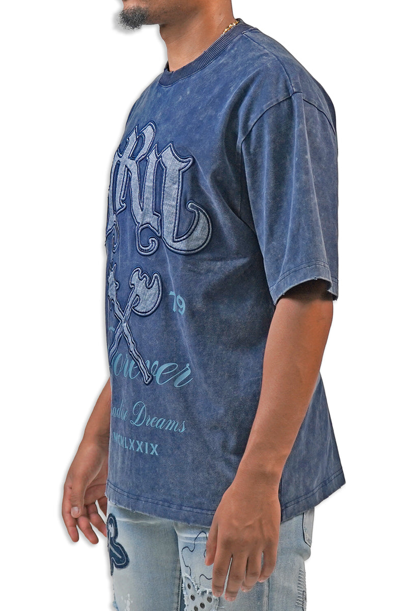 Person wearing a blue acid wash graphic t-shirt with text and design on a white background with text and graphics on the front Juren logo battle axe