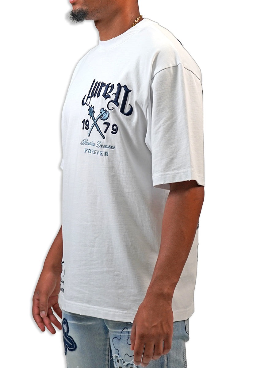 Person wearing a white t-shirt with navy text and graphics on a white "Juren 1979 Logo.