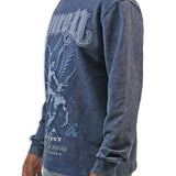 Man wearing a blue acid wash long-sleeve shirt with graphic design and text on a white background