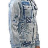 Denim jacket with branding and distressing on a white background