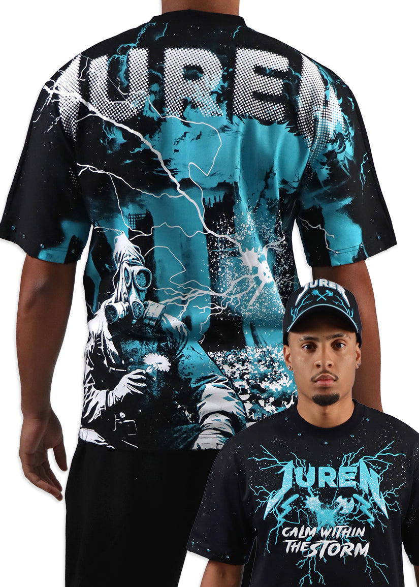 Person wearing a black t-shirt with a graphic design and text, standing next to another person wearing a cap.