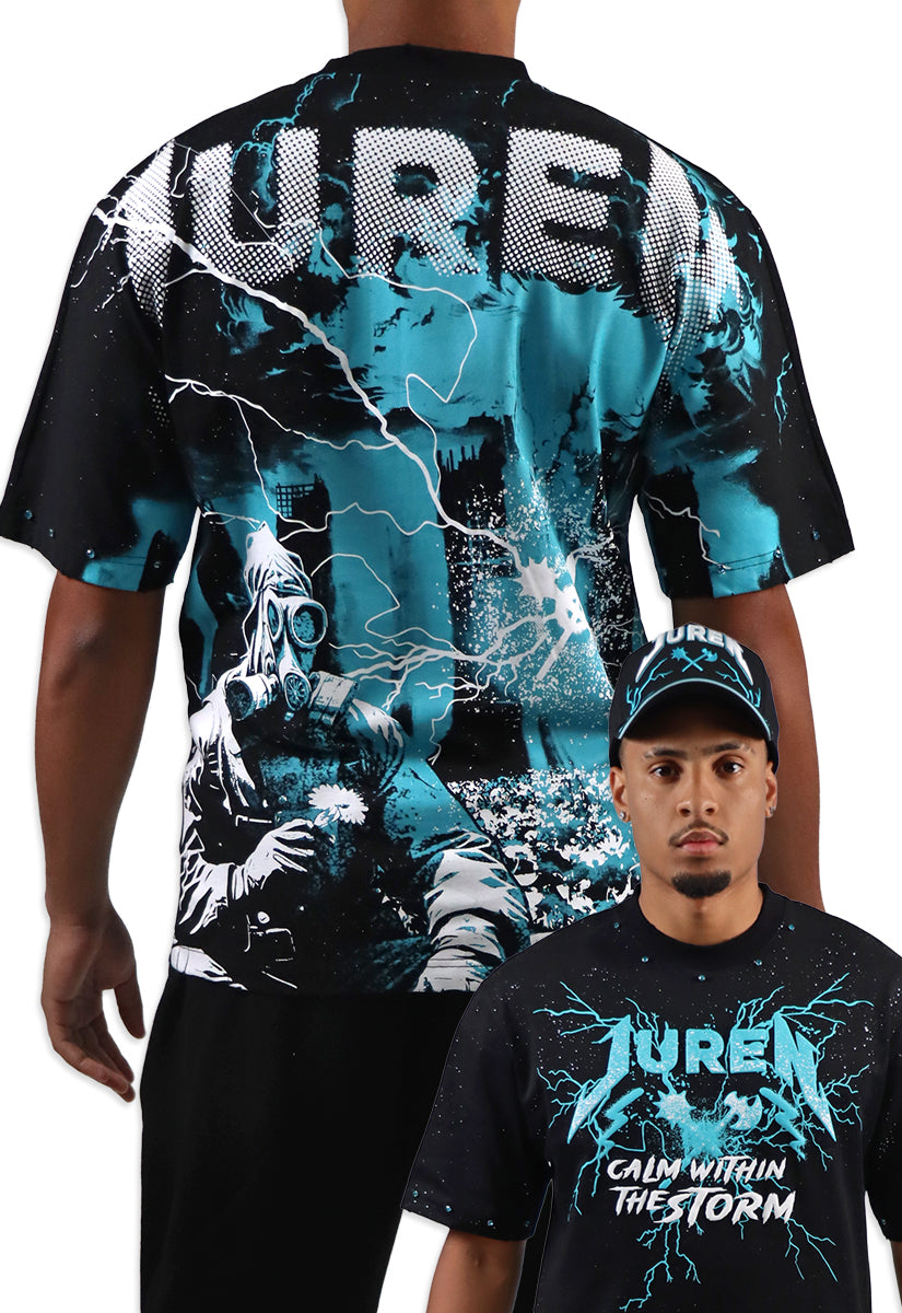 Person wearing a black t-shirt with a graphic design and text, standing next to another person wearing a cap.