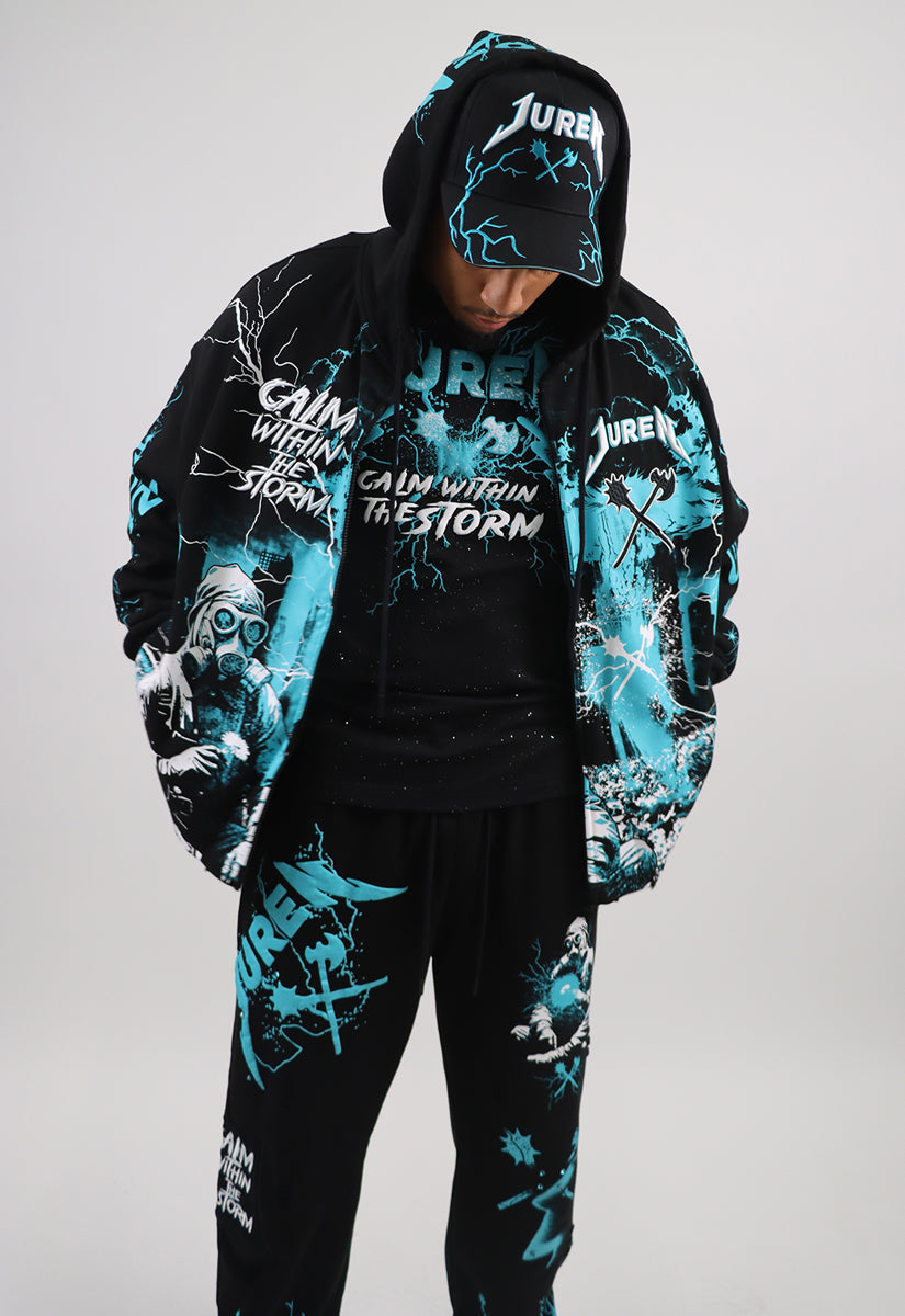 Person wearing a black hoodie with teal and white graphics and text, including the brand 'Juren'.