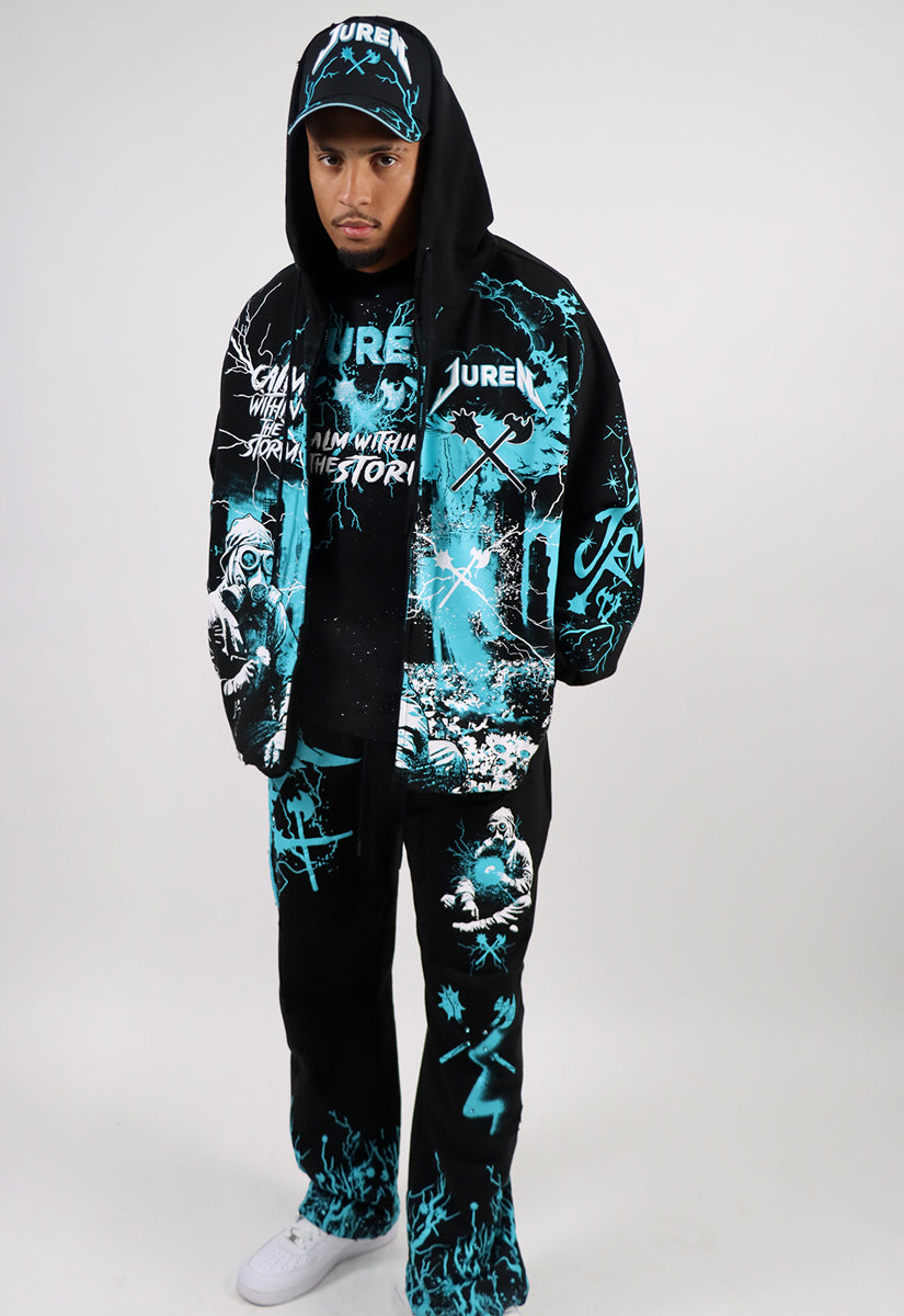 Person wearing a black and teal graphic hoodie and pants set on a white & teal background