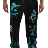 Black sweatpants with teal graphics worn by a person on a white background
