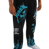 Black sweatpants with teal graphics and text worn by a person on a white background