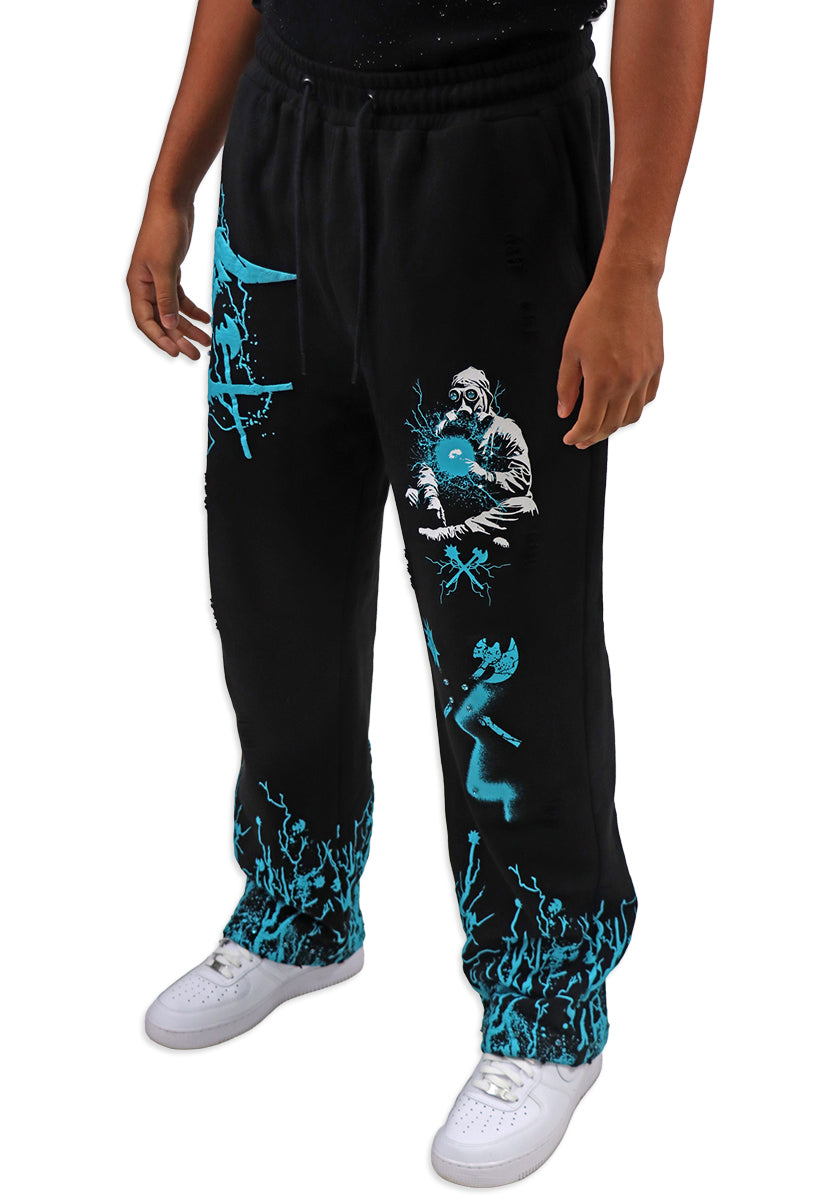Black sweatpants with teal graphics and a person wearing them on a white background