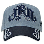 Light Blue Denim hat and navy visor with decorative text "JRN" Juren logo in Navy Embroidery on a Denim Background