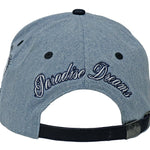 Light Blue Denim hat and navy visor with decorative text "JRN" Juren logo in Navy Embroidery on a Denim Background. In the back Paradise Dream in White embroidery and navy stitch outline.