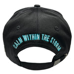 Black cap with 'Juren' logo in white and teal puff embroidered and teal lightning on visor