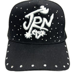 Black cap with white embellishments and 'JRN' logo on a white background