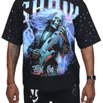Black t-shirt with a graphic design of a skeleton playing guitar against a starry sky, worn by a person.